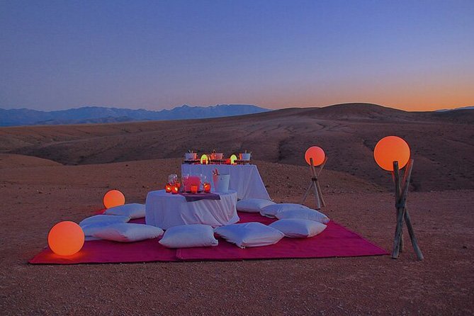 Luxurious Berber-style seating with plush cushions and rugs in Agafay Desert