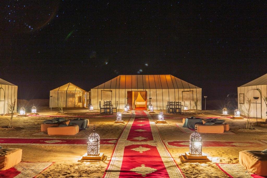 Inside a luxury desert glamping tent with traditional Moroccan decor